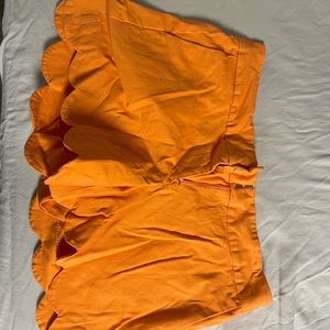 Orange shorts.
